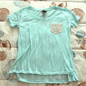Mint colored shirt with crocheted pocket detailing